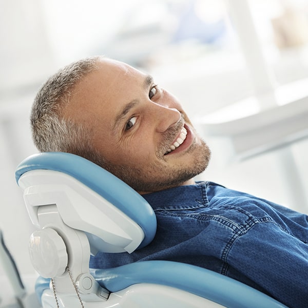 A mature man in the dentist chair