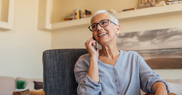 Elderly woman smiling with a dental crowns